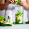 Probiotic Nutraceutical next to green smoothie